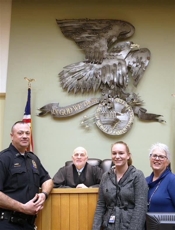 New Vision Law & Government student poses for a photo with mentors at the Fulton Courthouse. New Vision Law & Government student poses for a photo with mentors at the Fulton Courthouse.